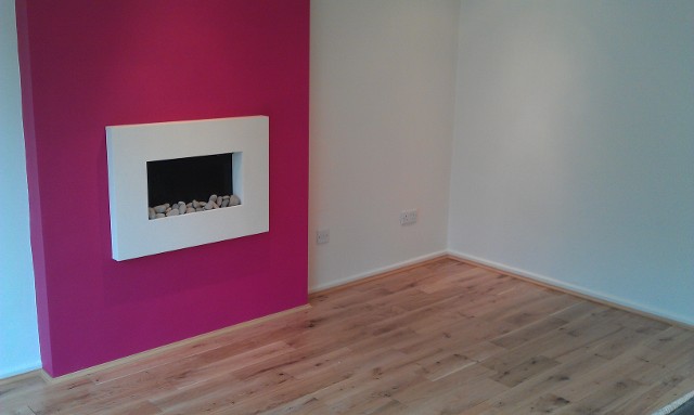 pink living room with fire